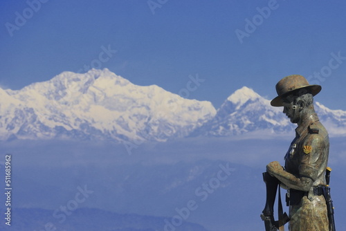 beautiful batasia loop, popular tourist place of darjeeling. batasia loop war memorial and snowcapped mount kangchenjunga in the background photo