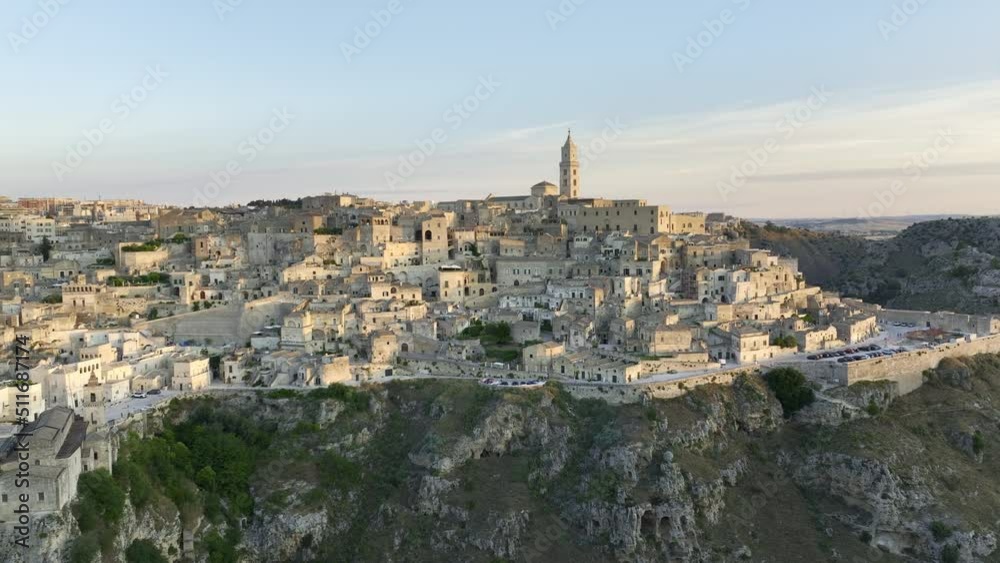 View from above, stunning aerial view of the Matera’s skyline during a beautiful sunrise. Matera is a city on a rocky outcrop in the region of Basilicata, in southern Italy. View from above, stunning aerial view of the Matera’s skyline during a beautiful sunrise. Matera is a city on a rocky outcrop in the region of Basilicata, in southern Italy.