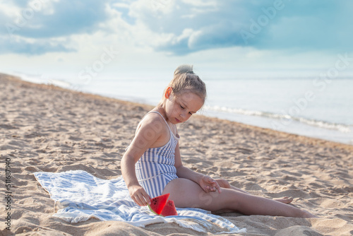 Smilling little girl eating watermelon. Summer, hollidays and travel concept. photo