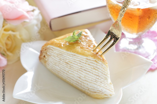 Piece of crepe cake with mint for tea break food © jreika