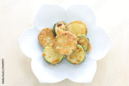 Korean food, fried zucchini slices on dish for comfort food image