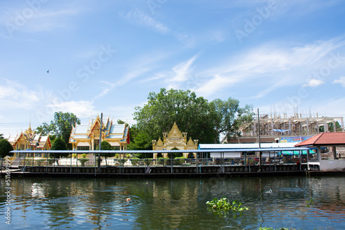 View landscape of Khlong Damnoen Saduak canal river and water flowing with cityscape countryside rural at Wat Thammachariya Phirom temple at Ban Phaeo city on June 8, 2022 in Samut Sakhon, Thailand photo