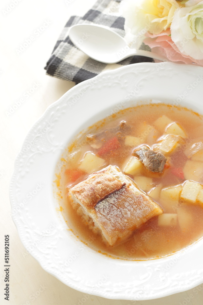 Homemade minestrone soup served with French bread Homemade minestrone soup served with French bread
