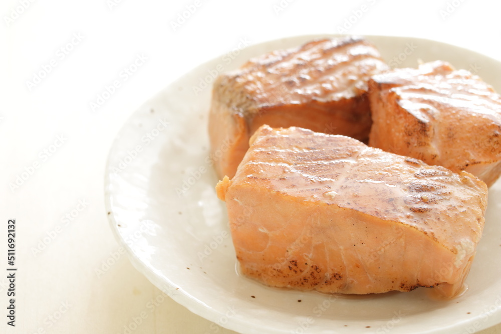 Canned food, grilled salmon on dish for emergency food image