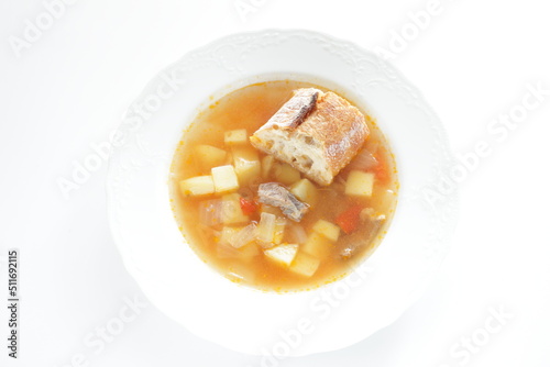 Homemade minestrone soup served with French bread
