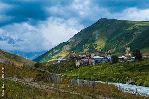 Village Ushguli landscape with massive rocky mountains