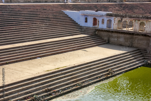 An ancient step well leading to water tank in a monument in the town of Deeg in Rajasthan. photo