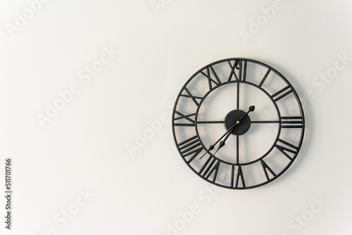 clock on the wall with a Roman dial with copy space