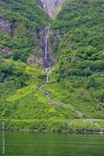 beautiful view of waterfalls and green nature in norway photo