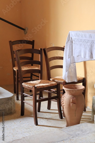 Church Interior Detail with Three Wooden Chairs in Central Italy photo