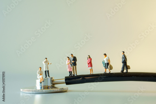 miniature doctor and people with mask on black stethoscope on white ground to solution for Annual Health Check up.