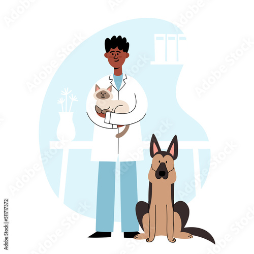 Veterinarian standing with cat and shepherd dog on vet interior