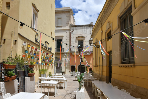 Tableau sur toile A narrow street between the old houses of Galatina, an old village in the province of Lecce in Italy