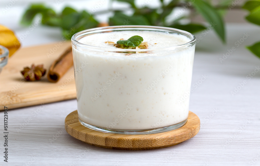 milkshake with walnut pieces and a sprig of fresh mint. gealthy eating milkshake with walnut pieces and a sprig of fresh mint. gealthy eating