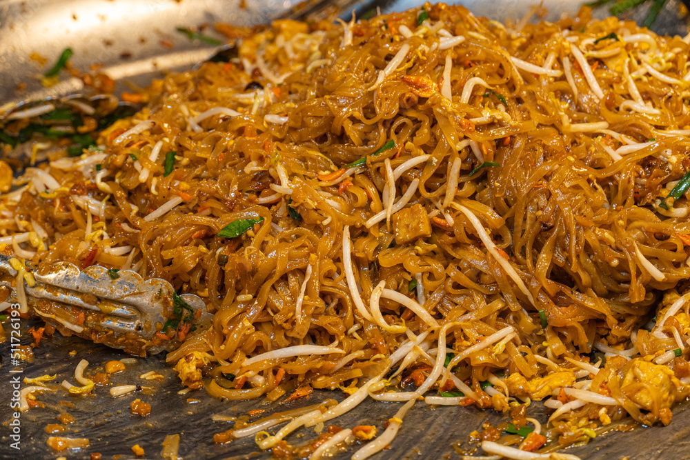 Pad Thai, a Thai dish made from noodles stir-fried with eggs, shrimp and vegetables mixed with Pad Thai sauce. Pad Thai, a Thai dish made from noodles stir-fried with eggs, shrimp and vegetables mixed with Pad Thai sauce.