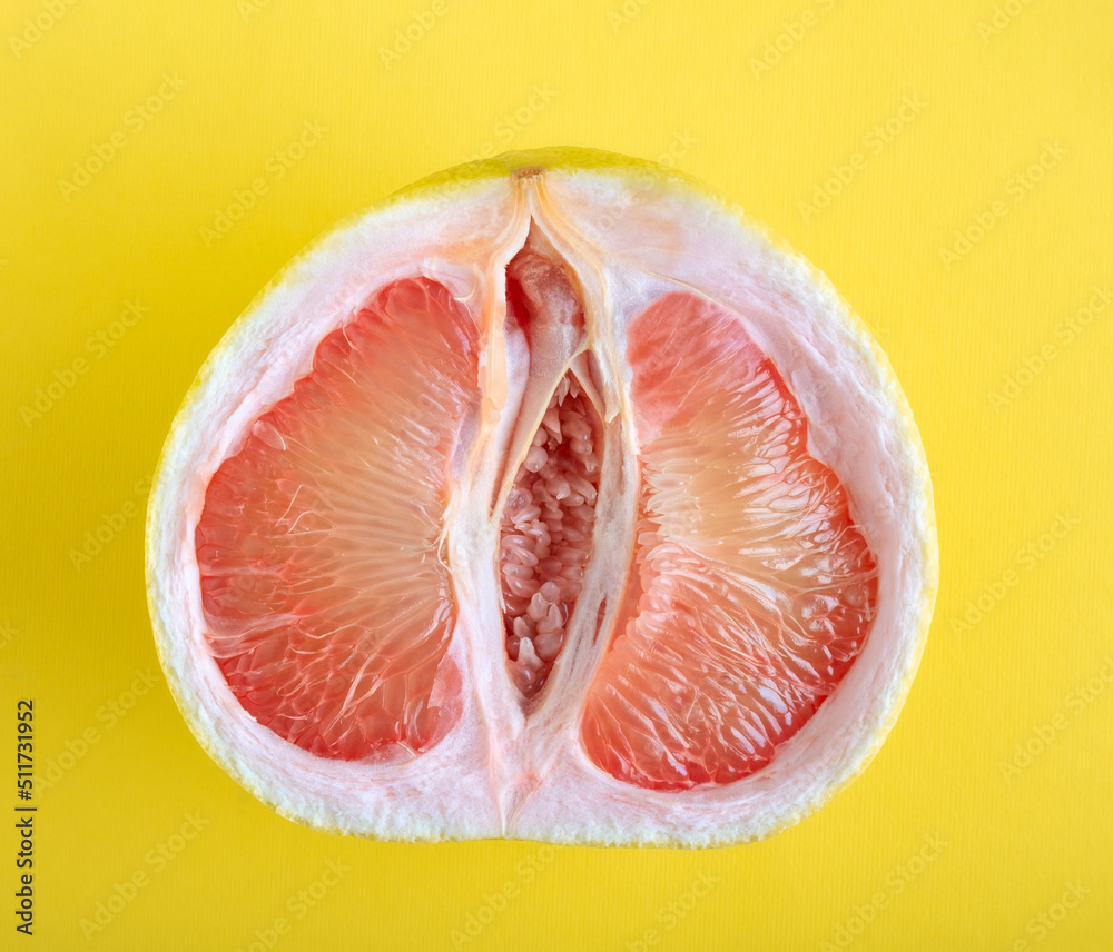 Top view ripe juicy grapefruit on yellow background. Top view ripe juicy grapefruit on yellow background.