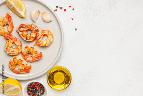 Seafood  langoustines grill with olive oil, lemon, garlic and spices on a wooden board. Top View. Copy space