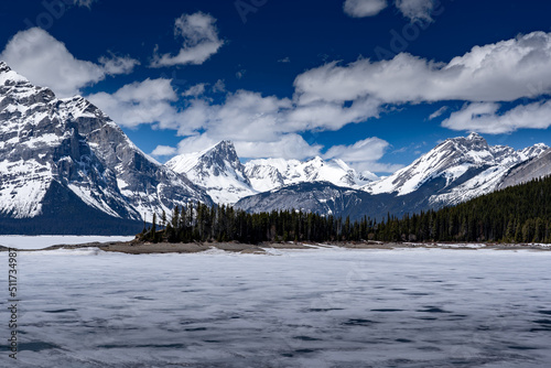 Upper Kananaskis Lake covered in melting frozen ice on a spring day in the Canadian Rocky Mountains near Banff. © Ramon Cliff