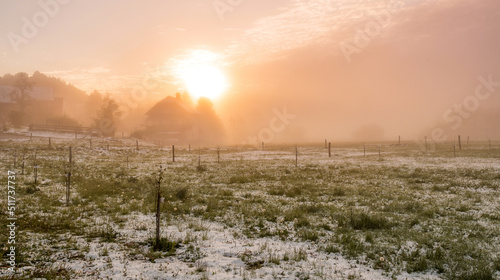 Misty sunrise at the countryside photo