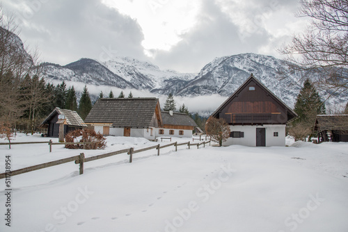 Cottages in winter with fog and mist and clouds. © gljivec