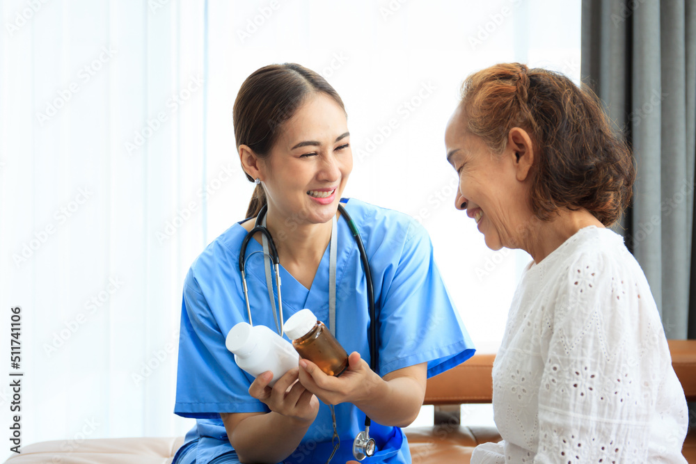 Fototapeta premium Female doctor comes to talk to elder patient in the hospital about the medical diagnosis. 