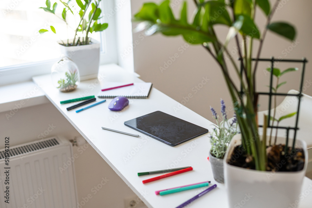 modern digital tablet with pen on a wooden desk modern digital tablet with pen on a wooden desk
