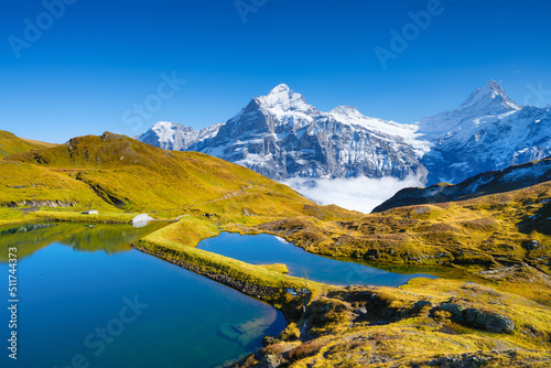 Grindelwald, Switzerland. High mountains and reflection on the surface of the...