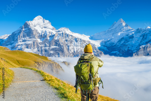 Tourist with a backpack in the mountains. Mountain hiking in the high mountains. Travel and adventure. Active life. Landscape in the summertime. © biletskiyevgeniy.com