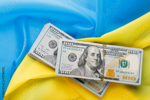 dollars against the background of the Ukrainian flag.  photo