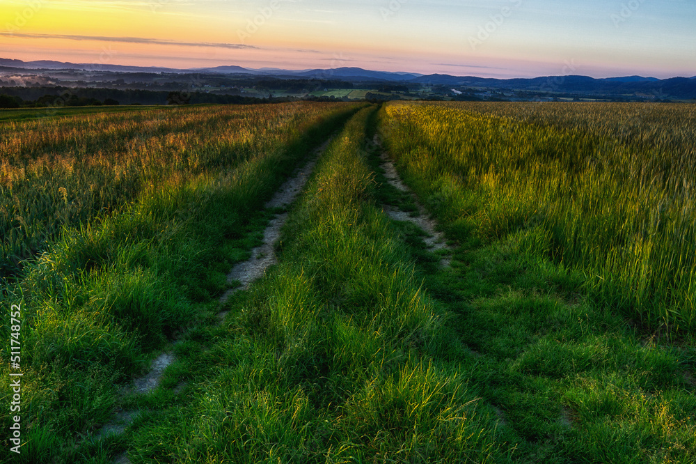 Fototapeta premium Sunrise over the road in the Little Beskids