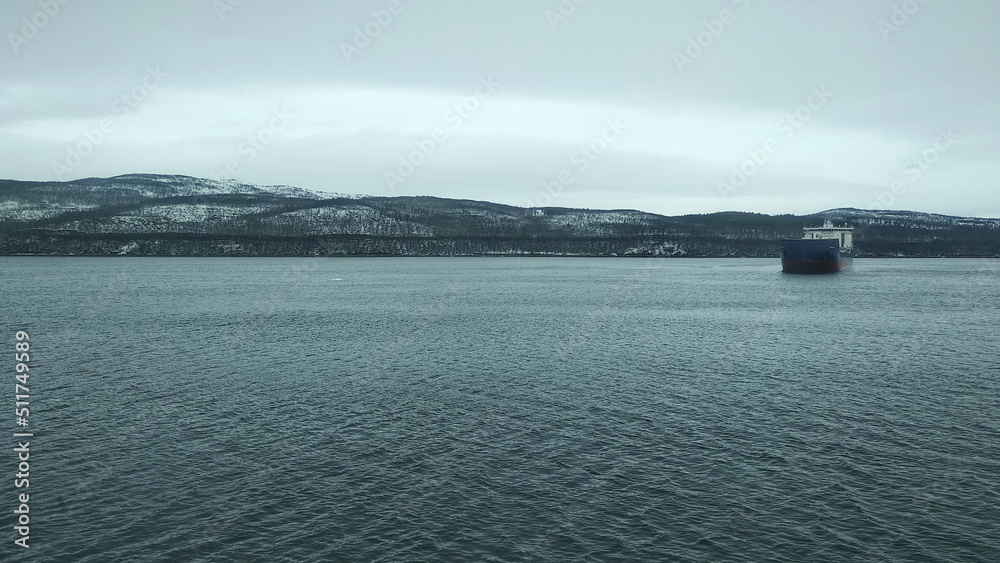 Northern landscapes. Kola river and winter hills. Kola Bay, Murmansk.