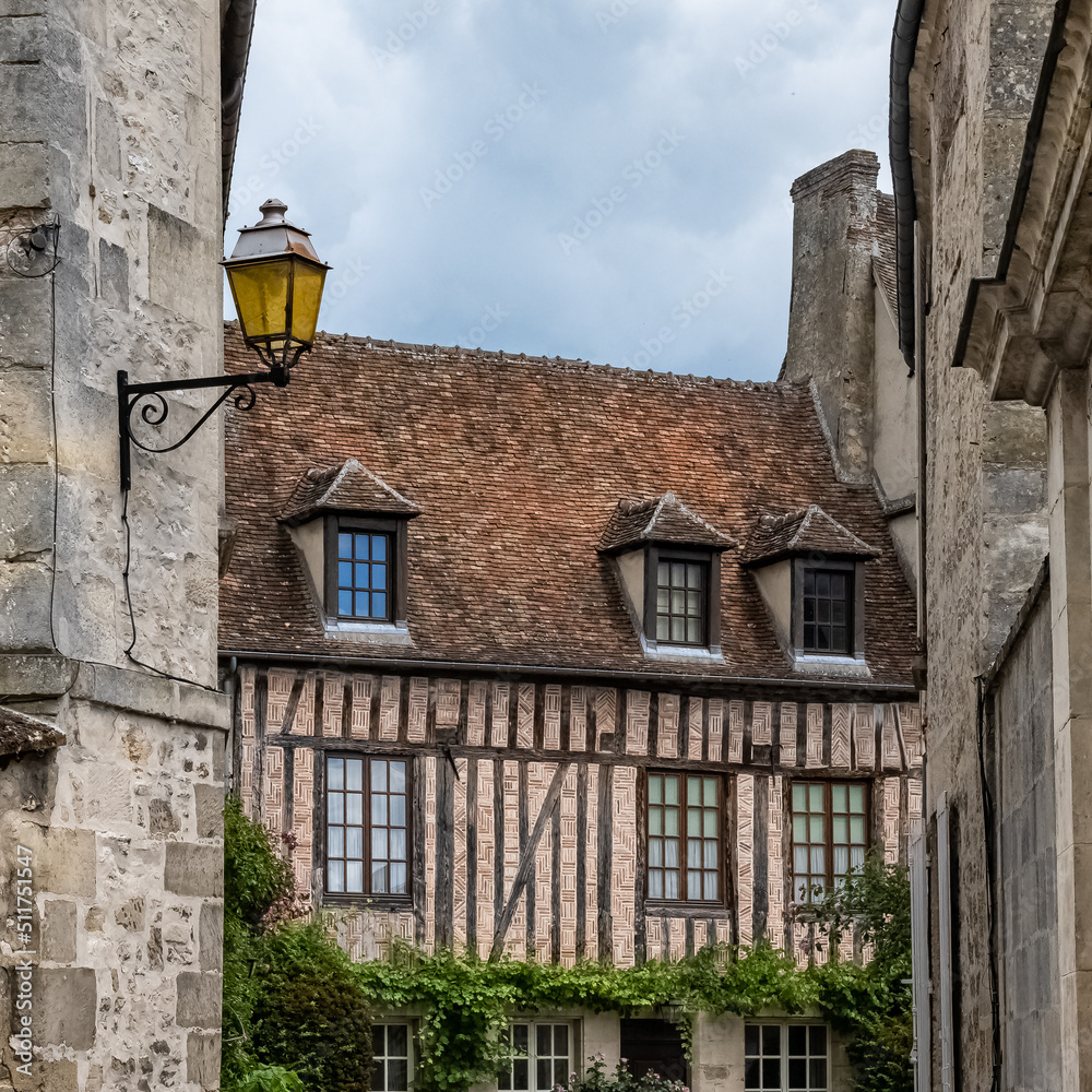 Senlis, medieval city in France, typical cobblestone street with ancient houses
Senlis, medieval city in France, typical cobblestone street with ancient houses