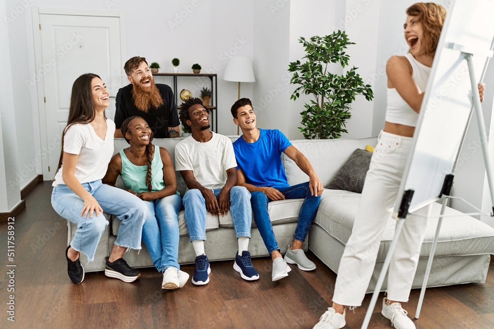 Group of young friends smiling happy playing drawing game at home. Group of young friends smiling happy playing drawing game at home.
