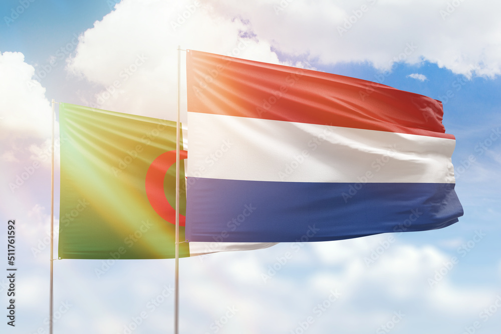 Sunny blue sky and flags of netherlands and algeria Sunny blue sky and flags of netherlands and algeria