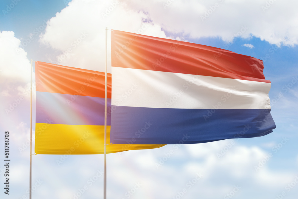 Sunny blue sky and flags of netherlands and armenia Sunny blue sky and flags of netherlands and armenia