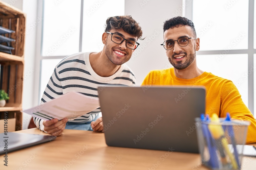Two man business workers using laptop working at office Two man business workers using laptop working at office