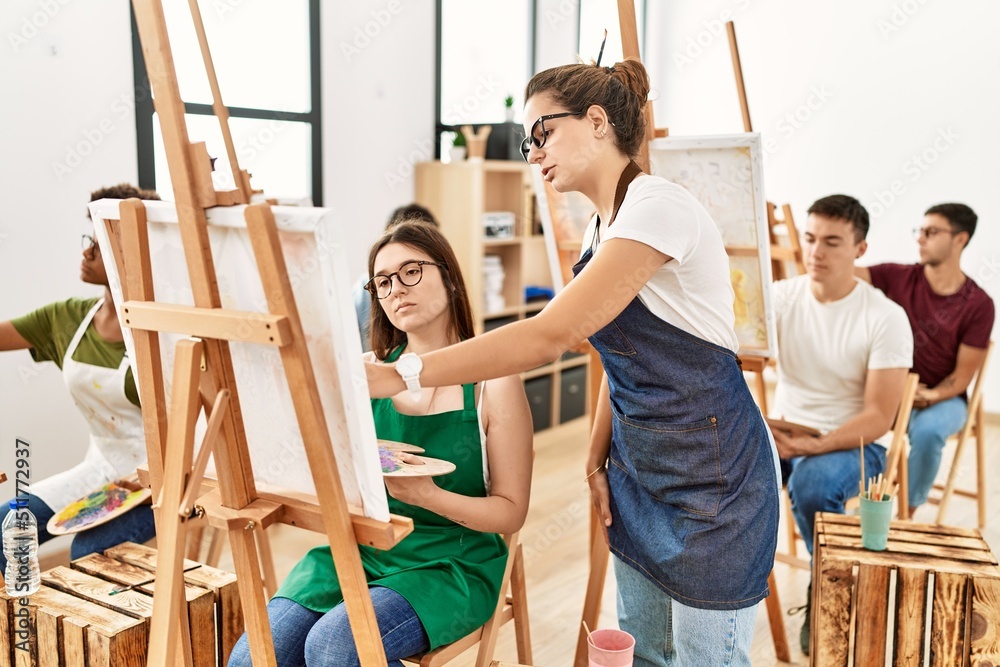 Paint teacher looking draw of student at art studio. Paint teacher looking draw of student at art studio.