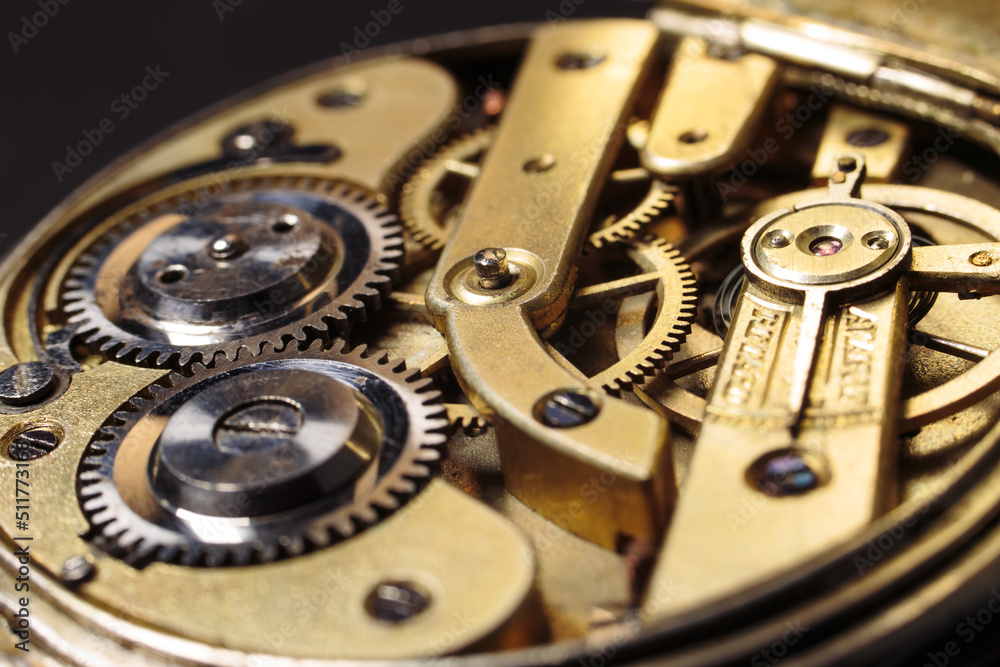 Old mechanical pocket watch. Clockwork gears wheels, close-up view. Old mechanical pocket watch. Clockwork gears wheels, close-up view.
