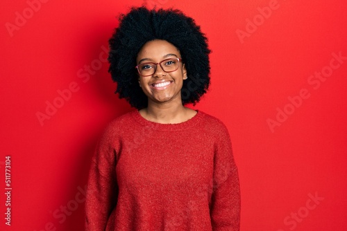 Young african american woman wearing casual clothes and glasses with a happy and cool smile on face. lucky person.