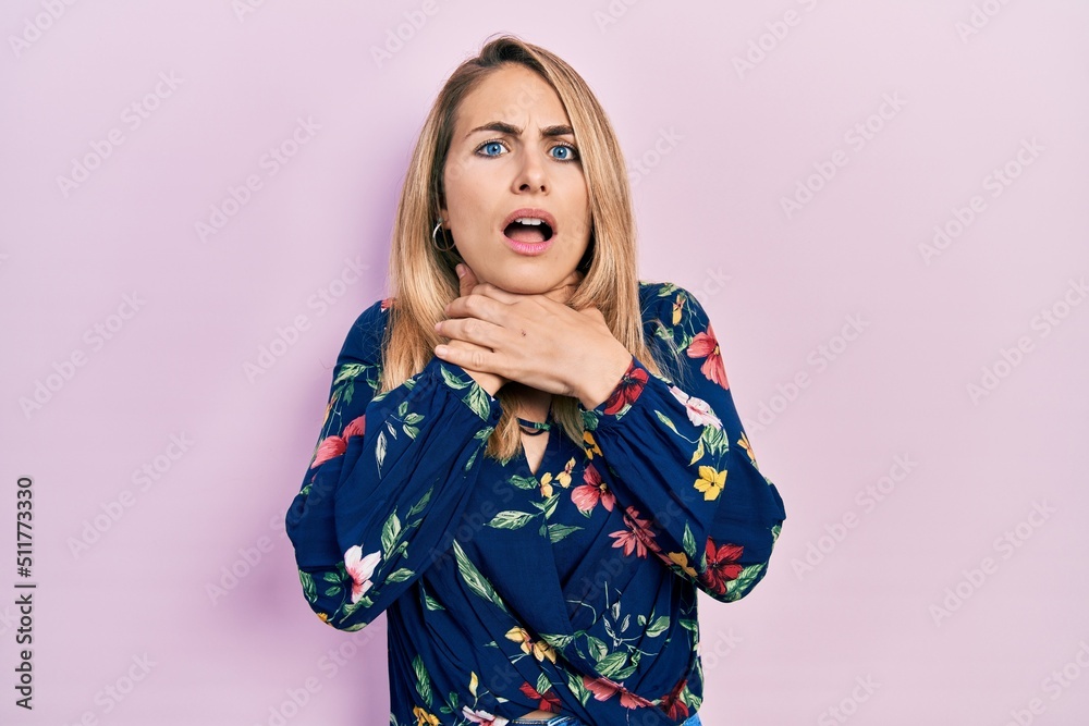 Young caucasian woman wearing casual clothes shouting and suffocate because painful strangle. health problem. asphyxiate and suicide concept. Young caucasian woman wearing casual clothes shouting and suffocate because painful strangle. health problem. asphyxiate and suicide concept.