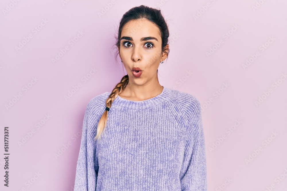 Young hispanic girl wearing casual clothes afraid and shocked with surprise expression, fear and excited face. Young hispanic girl wearing casual clothes afraid and shocked with surprise expression, fear and excited face.