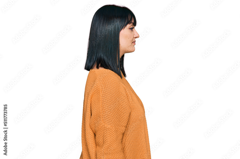 Young hispanic woman wearing casual clothes looking to side, relax profile pose with natural face and confident smile. Young hispanic woman wearing casual clothes looking to side, relax profile pose with natural face and confident smile.