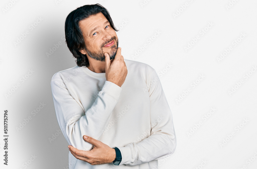 Middle age caucasian man wearing casual clothes looking confident at the camera smiling with crossed arms and hand raised on chin. thinking positive. Middle age caucasian man wearing casual clothes looking confident at the camera smiling with crossed arms and hand raised on chin. thinking positive.