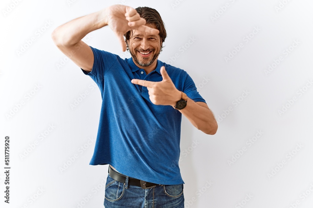 Handsome middle age man standing together over isolated background smiling making frame with hands and fingers with happy face. creativity and photography concept. Handsome middle age man standing together over isolated background smiling making frame with hands and fingers with happy face. creativity and photography concept.