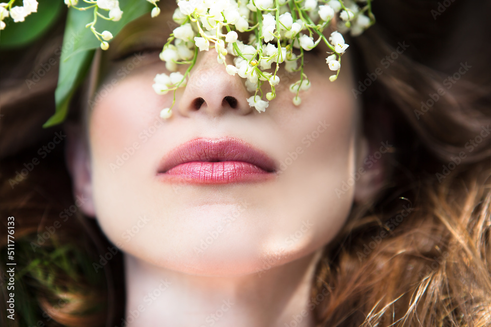 Portrait of happy young beautiful woman with lily of the valley bouquet. Top view. Portrait of happy young beautiful woman with lily of the valley bouquet. Top view.