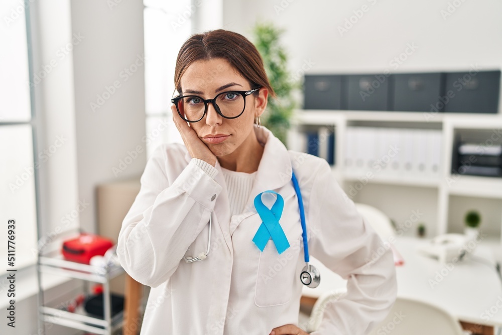 Young brunette doctor woman wearing stethoscope at the clinic thinking looking tired and bored with depression problems with crossed arms. Young brunette doctor woman wearing stethoscope at the clinic thinking looking tired and bored with depression problems with crossed arms.