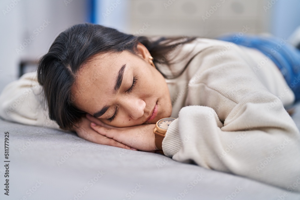 Young hispanic woman lying on sofa sleeping at home Young hispanic woman lying on sofa sleeping at home