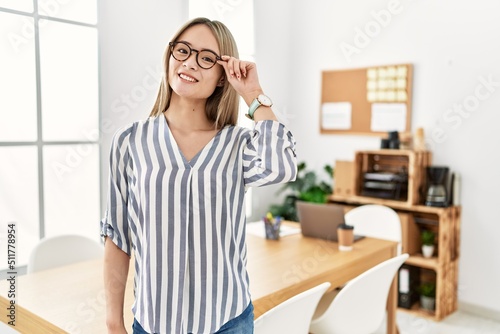 Young chinese woman smiling confident standing at office