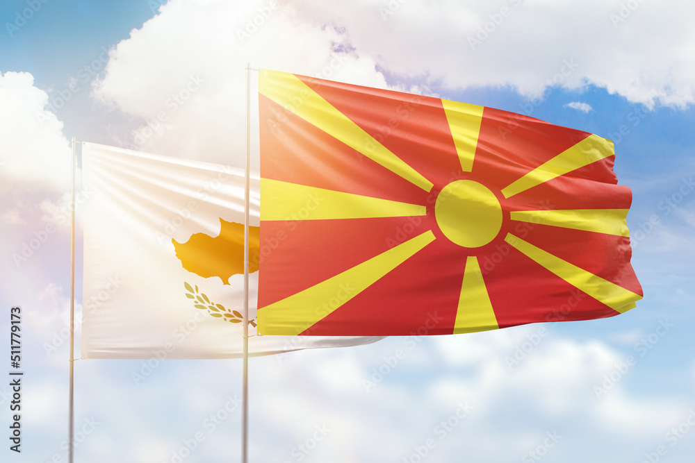 Sunny blue sky and flags of north macedonia and cyprus Sunny blue sky and flags of north macedonia and cyprus