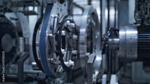 Wallpaper Mural Robotic tyre manufacturing equipment rotating with rubber tape at auto plant Torontodigital.ca